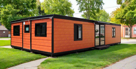 Rear angle of 3-bedroom container-style mobile home with black trim