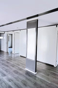 Wide interior view showing living area and entryway of prefab house