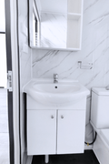 Bathroom view with mounted vanity and under-sink cabinet