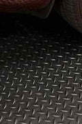 Diamond Rubber Flooring Roll Installed in Garage – Black Non-Slip Surface

Heavy-Duty Rubber Flooring Texture – Diamond Pattern Close-Up

Garage or Gym Flooring Roll – Industrial Rubber Mat

Industrial Rubber Roll Mat – 40 SQFT and 125 SQFT Options Available