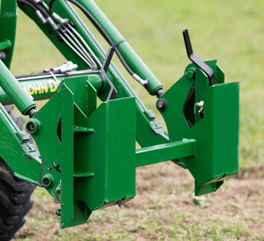Quick Tach Adapter for John Deere to Skid Steer – 4000 lb
Heavy-duty conversion adapter bracket in green finish
Side view of steel JD quick attach adapter plate
Universal skid steer quick attach converter for tractors 
4000 lb skid steer adapter bracket for JD loaders