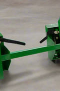 Quick Tach Adapter for John Deere to Skid Steer – 4000 lb
Heavy-duty conversion adapter bracket in green finish
Side view of steel JD quick attach adapter plate
Universal skid steer quick attach converter for tractors 
4000 lb skid steer adapter bracket for JD loaders