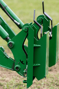 Quick Tach Adapter for John Deere to Skid Steer – 4000 lb
Heavy-duty conversion adapter bracket in green finish
Side view of steel JD quick attach adapter plate
Universal skid steer quick attach converter for tractors 
4000 lb skid steer adapter bracket for JD loaders