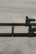 43-inch clamp-on pallet forks with stabilizer bar installed on tractor
Skid steer pallet forks loading hay bales
Adjustable clamp pallet forks for farm and industrial use
Tractor bucket pallet fork attachment with 4,000 lb capacity
Clamp-on pallet forks close-up showing tension screws and bracket