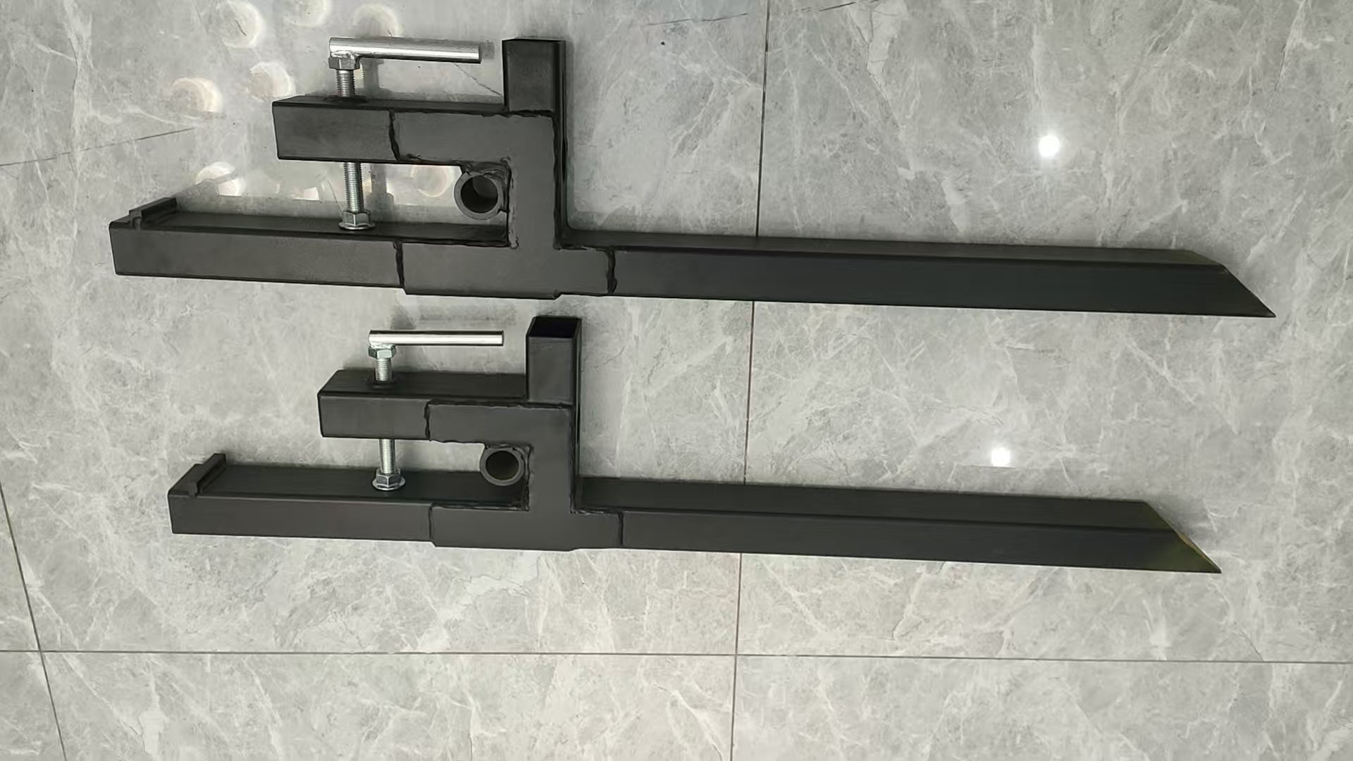 "43 Inch Heavy Duty Clamp On Bucket Forks for Tractor"

"2,000 LB Capacity Pallet Forks for Skid Steer and Tractor"

"Clamp On Fork Attachments for Tractor Buckets"

"Heavy Duty Steel Bucket Forks for Moving Pallets and Logs"