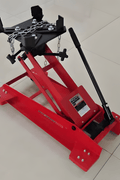 Adjustable 1100 lb transmission lift jack with swivel casters