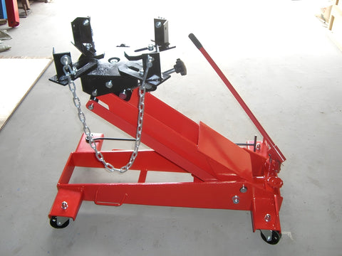 3300 lb red transmission jack on shop floor with dual handles