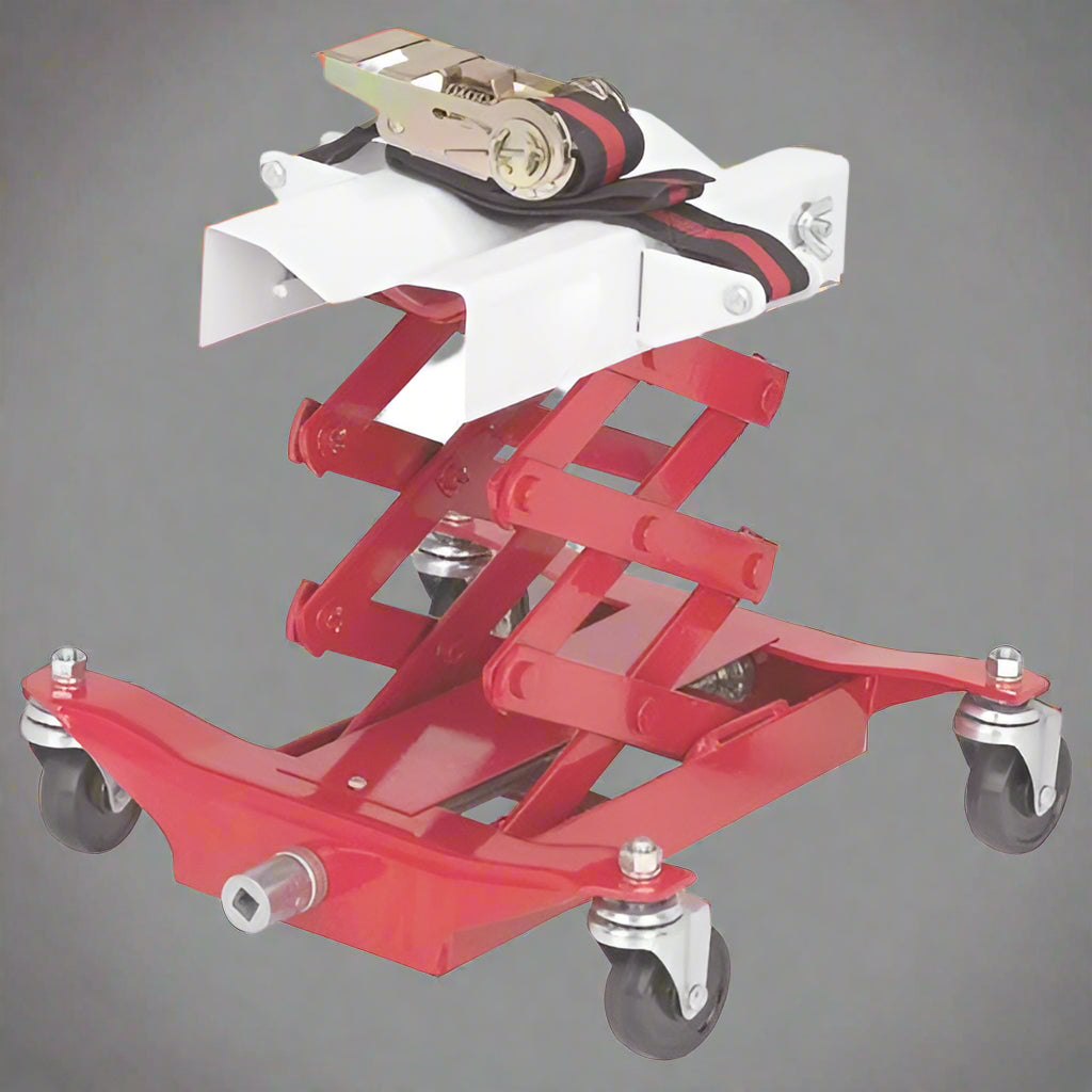 “450 lb red low lift transmission jack with swivel casters”

“Heavy-duty steel frame transmission jack under vehicle”

“Low-profile automotive transmission lift tool”