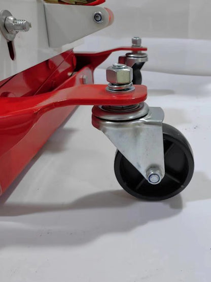 “450 lb red low lift transmission jack with swivel casters”

“Heavy-duty steel frame transmission jack under vehicle”

“Low-profile automotive transmission lift tool”