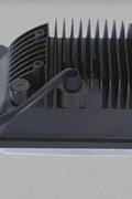Rear view of 45W 4x6 LED headlight with aluminum heat dissipation fins and 3-prong plug
