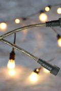 48 Ft S14 LED string lights installed at outdoor wedding
Close-up of S14 warm white LED bulb
Waterproof LED string lights cable
Full 48 ft patio string lights set with 15 bulbs
Outdoor café setting with LED string lighting