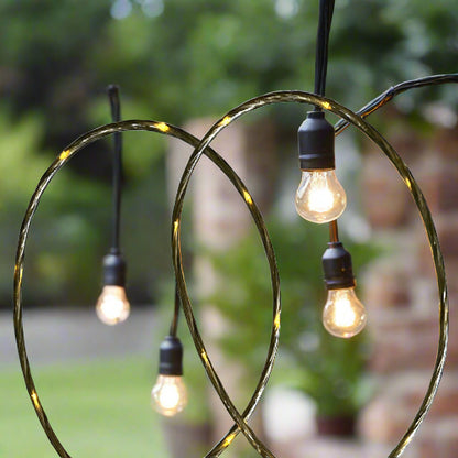 48 Ft S14 LED string lights installed at outdoor wedding
Close-up of S14 warm white LED bulb
Waterproof LED string lights cable
Full 48 ft patio string lights set with 15 bulbs
Outdoor café setting with LED string lighting