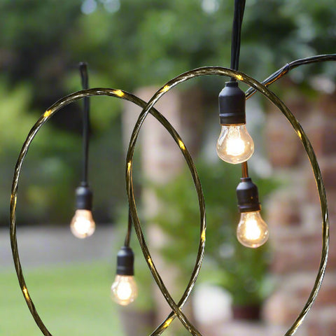 48 Ft S14 LED string lights installed at outdoor wedding
Close-up of S14 warm white LED bulb
Waterproof LED string lights cable
Full 48 ft patio string lights set with 15 bulbs
Outdoor café setting with LED string lighting