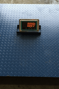 4x4 FT digital floor scale with steel checkered platform

Industrial-grade wired floor scale with LCD display

Heavy-duty 10,000 LB capacity scale with digital indicator

Digital floor scale used for freight weighing

Close-up of steel plate and load cell feet on floor scale