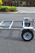 "4x8 folding aluminum utility trailer with built-in casters"

"Space-saving lightweight trailer for small vehicle hauling"

"Compact aluminum trailer folded vertically for storage"