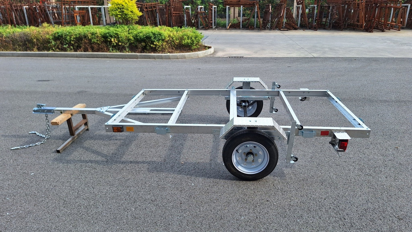"4x8 folding aluminum utility trailer with built-in casters"

"Space-saving lightweight trailer for small vehicle hauling"

"Compact aluminum trailer folded vertically for storage"
