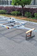 "4x8 folding aluminum utility trailer with built-in casters"

"Space-saving lightweight trailer for small vehicle hauling"

"Compact aluminum trailer folded vertically for storage"