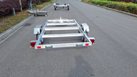 "4x8 folding aluminum utility trailer with built-in casters"

"Space-saving lightweight trailer for small vehicle hauling"

"Compact aluminum trailer folded vertically for storage"