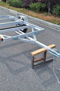 "4x8 folding aluminum utility trailer with built-in casters"

"Space-saving lightweight trailer for small vehicle hauling"

"Compact aluminum trailer folded vertically for storage"
