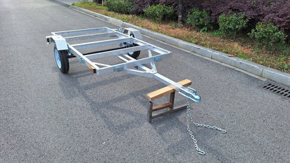 "4x8 folding aluminum utility trailer with built-in casters"

"Space-saving lightweight trailer for small vehicle hauling"

"Compact aluminum trailer folded vertically for storage"