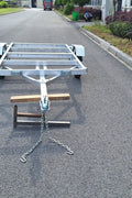"4x8 folding aluminum utility trailer with built-in casters"

"Space-saving lightweight trailer for small vehicle hauling"

"Compact aluminum trailer folded vertically for storage"