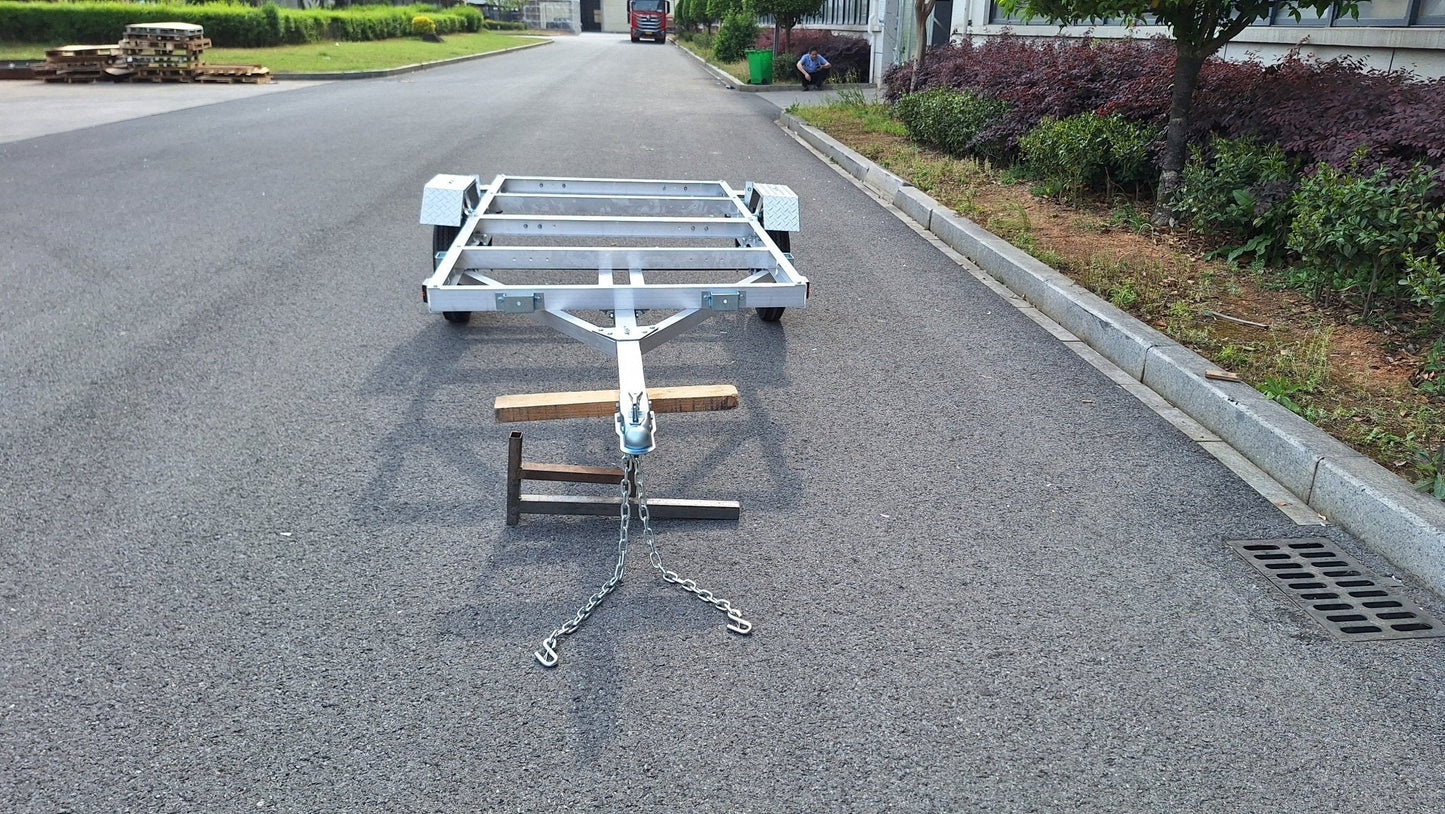 "4x8 folding aluminum utility trailer with built-in casters"

"Space-saving lightweight trailer for small vehicle hauling"

"Compact aluminum trailer folded vertically for storage"