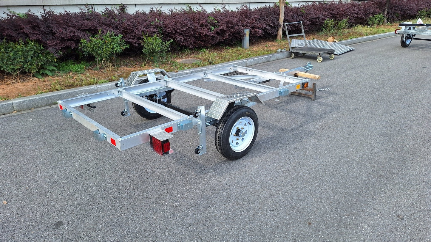 "4x8 folding aluminum utility trailer with built-in casters"

"Space-saving lightweight trailer for small vehicle hauling"

"Compact aluminum trailer folded vertically for storage"