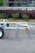 "4x8 folding aluminum utility trailer with built-in casters"

"Space-saving lightweight trailer for small vehicle hauling"

"Compact aluminum trailer folded vertically for storage"