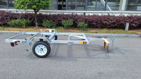 "4x8 folding aluminum utility trailer with built-in casters"

"Space-saving lightweight trailer for small vehicle hauling"

"Compact aluminum trailer folded vertically for storage"