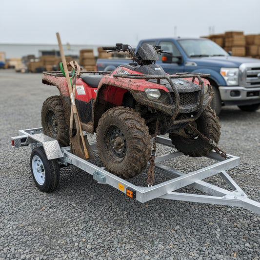 "4x8 folding aluminum utility trailer with built-in casters"

"Space-saving lightweight trailer for small vehicle hauling"

"Compact aluminum trailer folded vertically for storage"