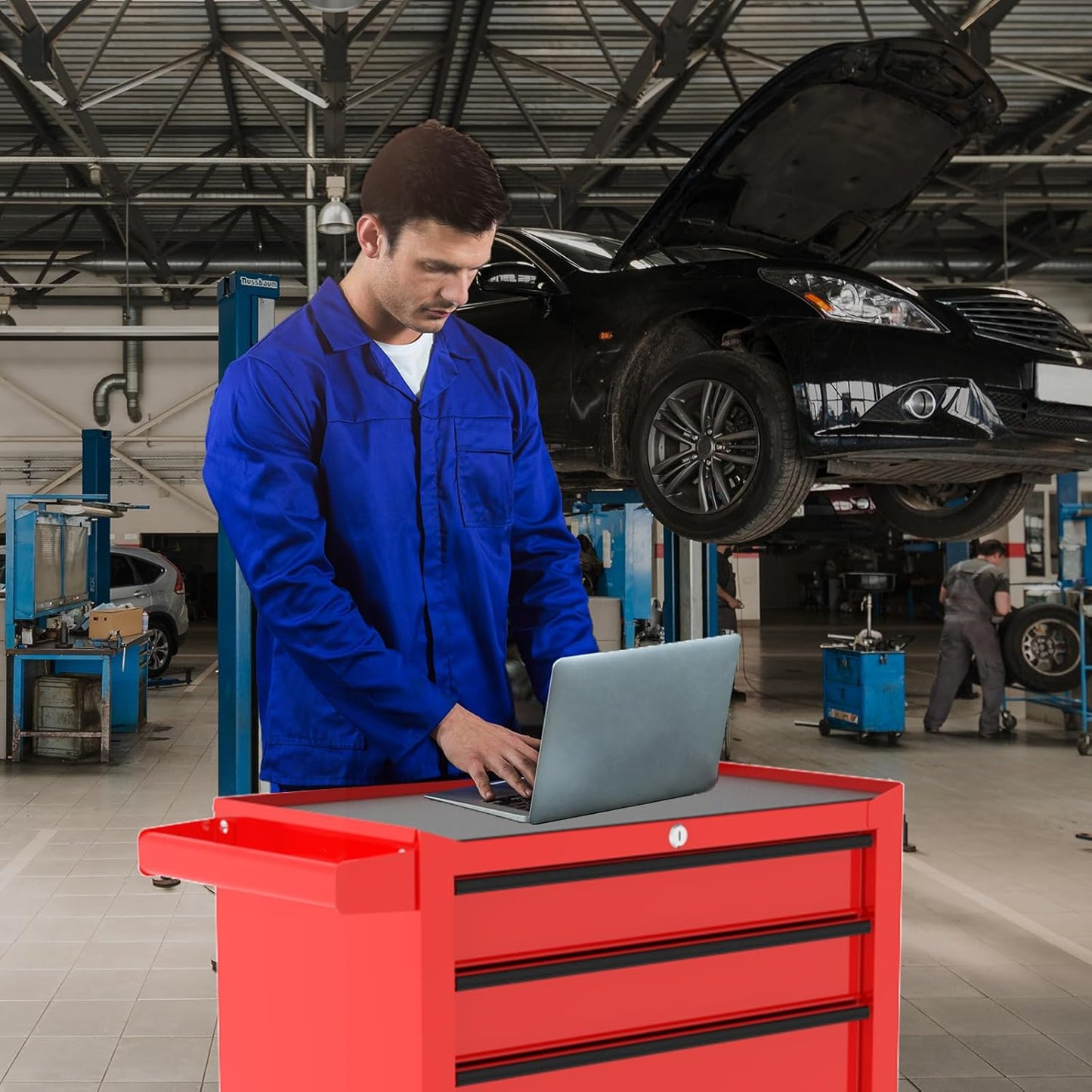 5-drawer red rolling tool cabinet with locking wheels

Compact steel tool chest for garage storage

Powder-coated mobile tool cabinet with drawers

Mechanic using red steel rolling toolbox

Side view of lockable 5-drawer garage cabinet

