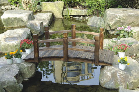 Decorative arched garden bridge with natural wood finish