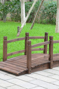 5 foot wooden garden bridge over stone path in green yard