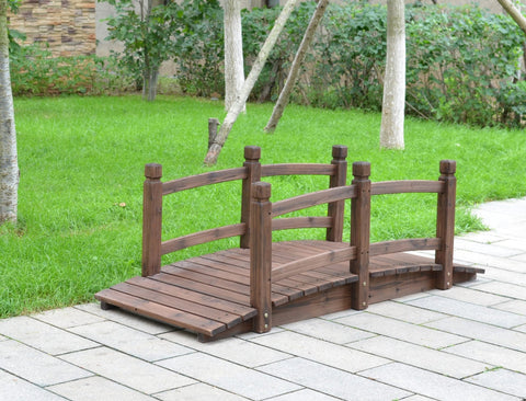 5 foot wooden garden bridge over stone path in green yard