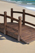 Wooden landscaping bridge assembled outdoors