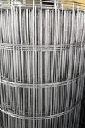 Roll of 5x100 ft wire mesh fencing

Fence label: "No-Climb Wire Mesh – Light Duty"

Close-up of 2"x4" galvanized mesh