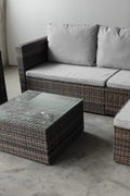 "5-piece L-shaped outdoor sectional with cushions and table"

"Modular patio furniture set in backyard setting"

"Gray cushioned patio sofa with glass coffee table"

"Weatherproof outdoor wicker sectional for patio"

"Durable resin wicker outdoor furniture with ottomans"