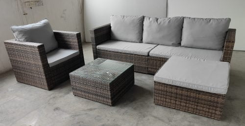 "5-piece L-shaped outdoor sectional with cushions and table"

"Modular patio furniture set in backyard setting"

"Gray cushioned patio sofa with glass coffee table"

"Weatherproof outdoor wicker sectional for patio"

"Durable resin wicker outdoor furniture with ottomans"