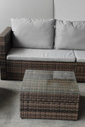 "5-piece L-shaped outdoor sectional with cushions and table"

"Modular patio furniture set in backyard setting"

"Gray cushioned patio sofa with glass coffee table"

"Weatherproof outdoor wicker sectional for patio"

"Durable resin wicker outdoor furniture with ottomans"