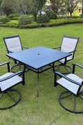 5-piece outdoor swivel dining set in garden setup

Black swivel dining chairs with cushions

Round glass-top patio dining table

Outdoor dining set with umbrella

Side view of black patio chairs and table