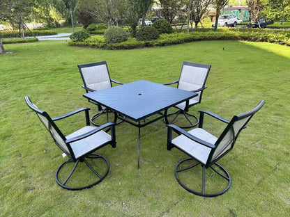 5-piece outdoor swivel dining set in garden setup

Black swivel dining chairs with cushions

Round glass-top patio dining table

Outdoor dining set with umbrella

Side view of black patio chairs and table