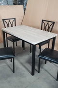 5-piece black dining table and chair set
Faux leather upholstered dining chairs
Full view of dining table with 4 chairs
Close-up of chair cushion
Dining room furniture set in black finish