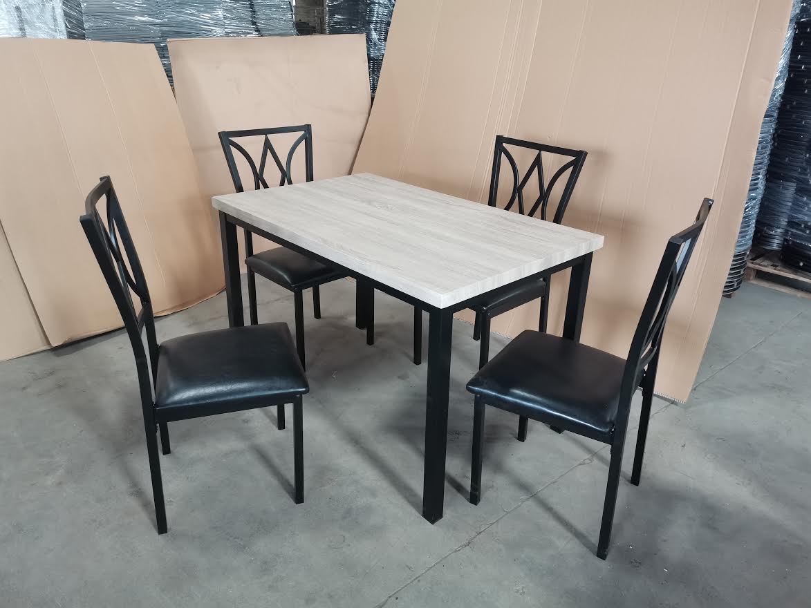 5-piece black dining table and chair set
Faux leather upholstered dining chairs
Full view of dining table with 4 chairs
Close-up of chair cushion
Dining room furniture set in black finish