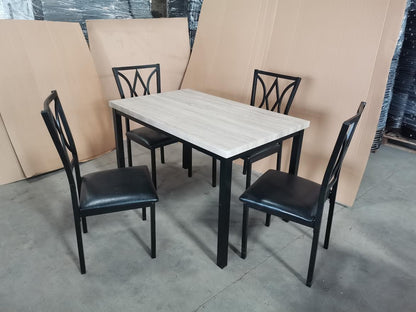 5-piece black dining table and chair set
Faux leather upholstered dining chairs
Full view of dining table with 4 chairs
Close-up of chair cushion
Dining room furniture set in black finish