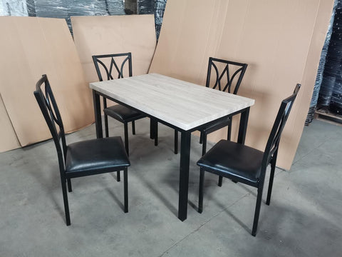 5-piece black dining table and chair set
Faux leather upholstered dining chairs
Full view of dining table with 4 chairs
Close-up of chair cushion
Dining room furniture set in black finish