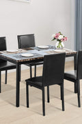 Black faux marble dining table with 4 black chairs
Side view of faux marble dining set in dining area
Chair detail showing faux leather upholstery
Compact 5-piece kitchen dining table set