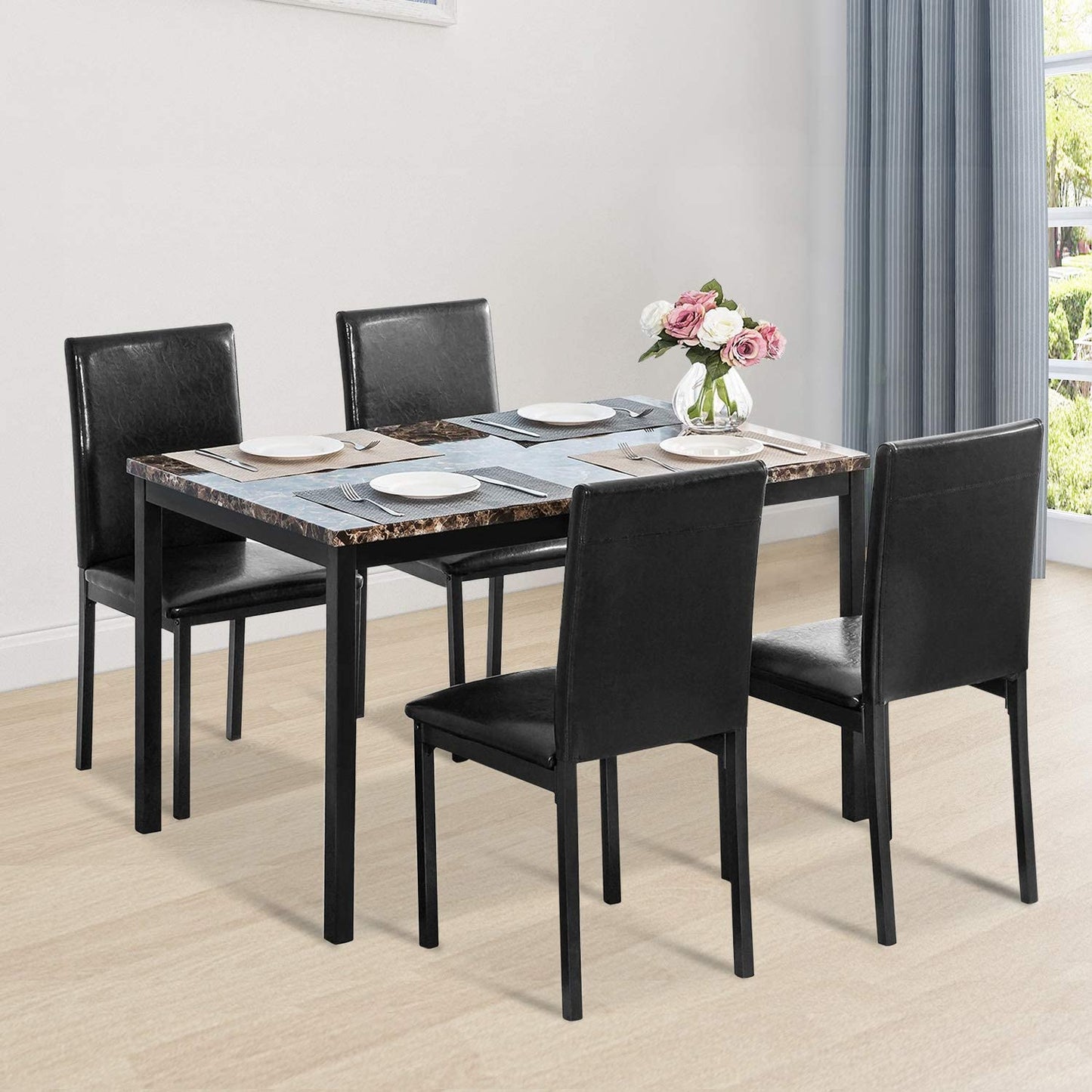 Black faux marble dining table with 4 black chairs
Side view of faux marble dining set in dining area
Chair detail showing faux leather upholstery
Compact 5-piece kitchen dining table set