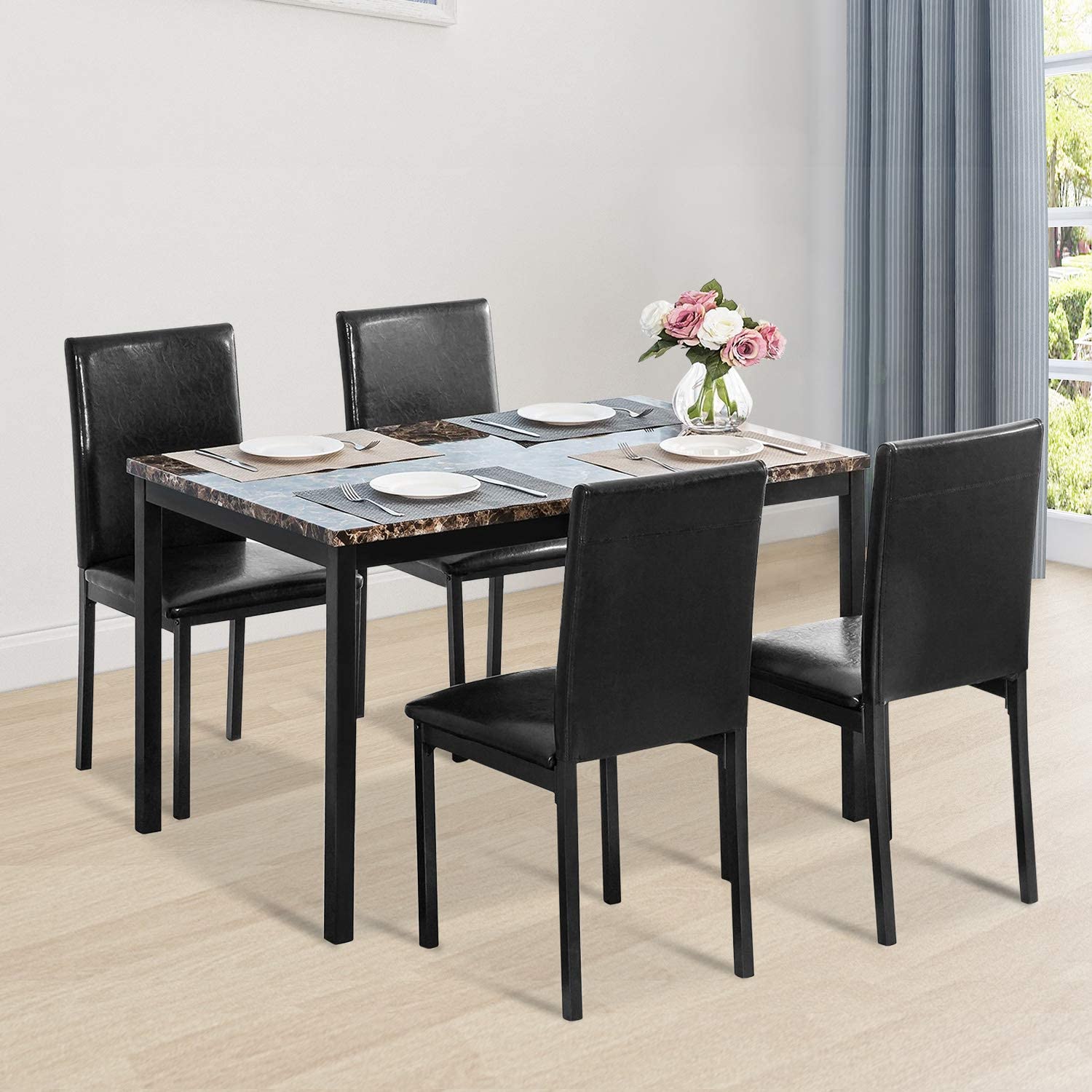Black faux marble dining table with 4 black chairs
Side view of faux marble dining set in dining area
Chair detail showing faux leather upholstery
Compact 5-piece kitchen dining table set