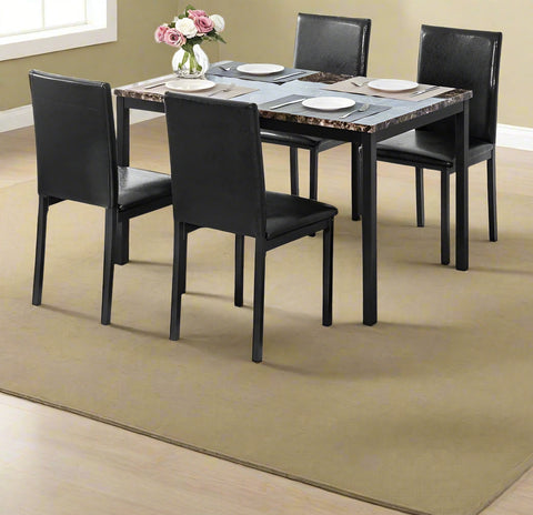 Black faux marble dining table with 4 black chairs
Side view of faux marble dining set in dining area
Chair detail showing faux leather upholstery
Compact 5-piece kitchen dining table set