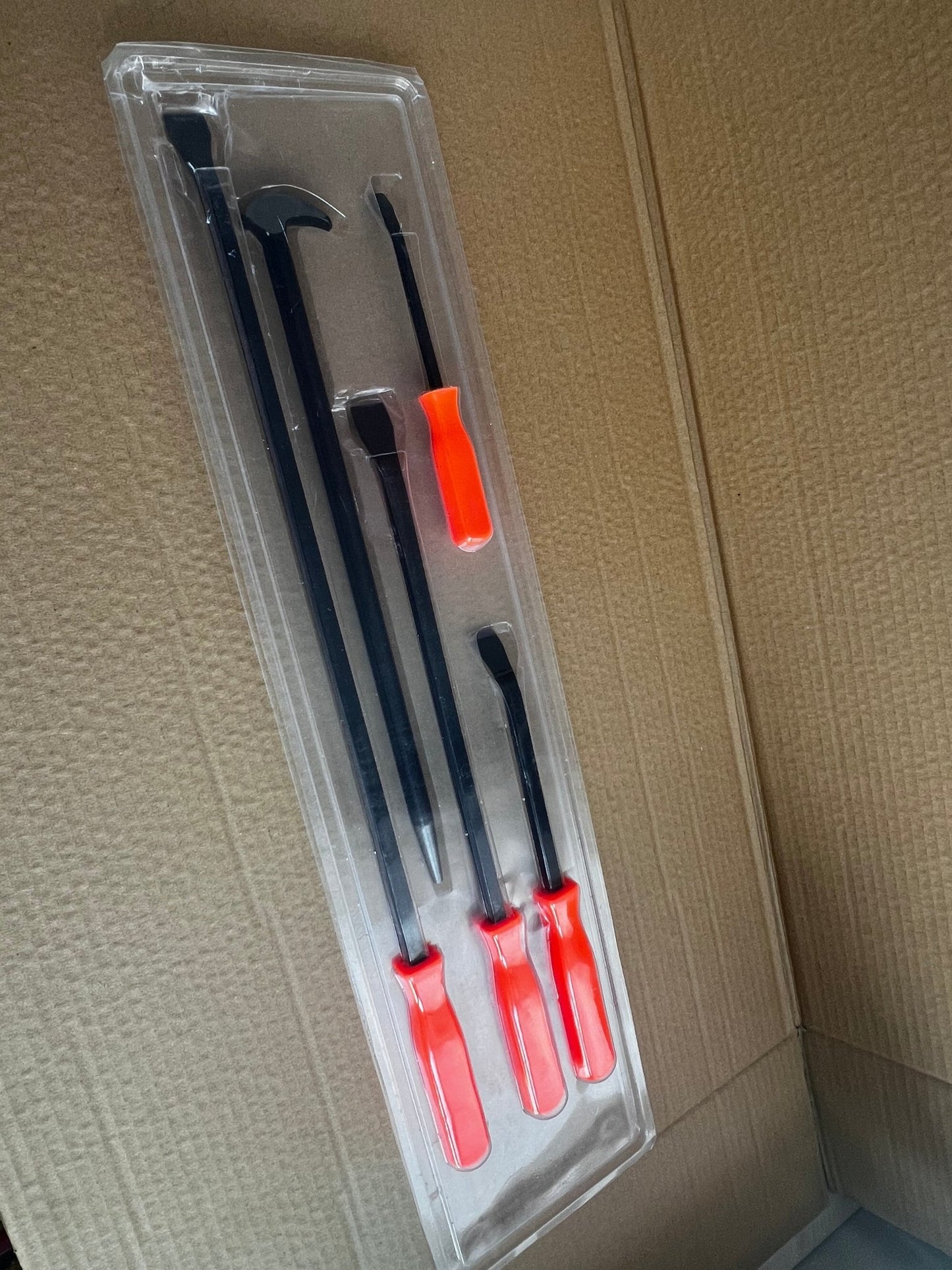 Set of 5 heavy-duty pry bars with red ergonomic grips

Close-up of steel pry bars arranged in foam insert

Demolition pry bar kit with grip handles

Automotive pry tools set displayed on workbench